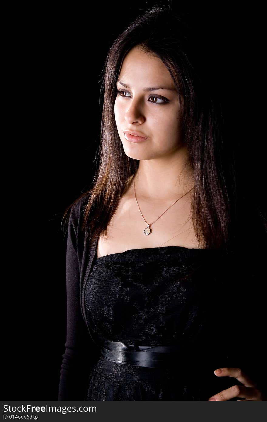 The model in a black dress with a necklace