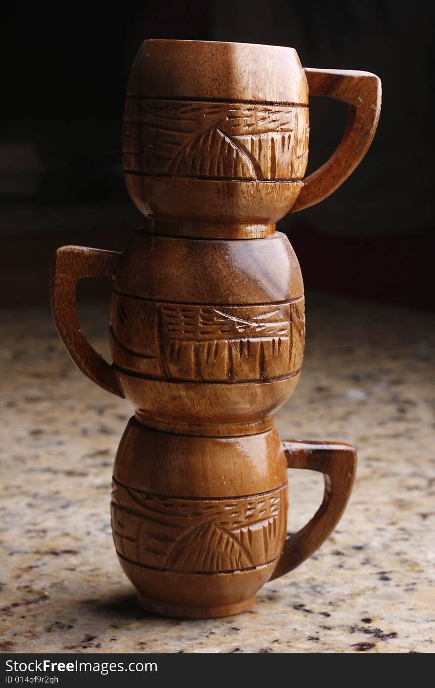 Wooden tea cup on top of one another