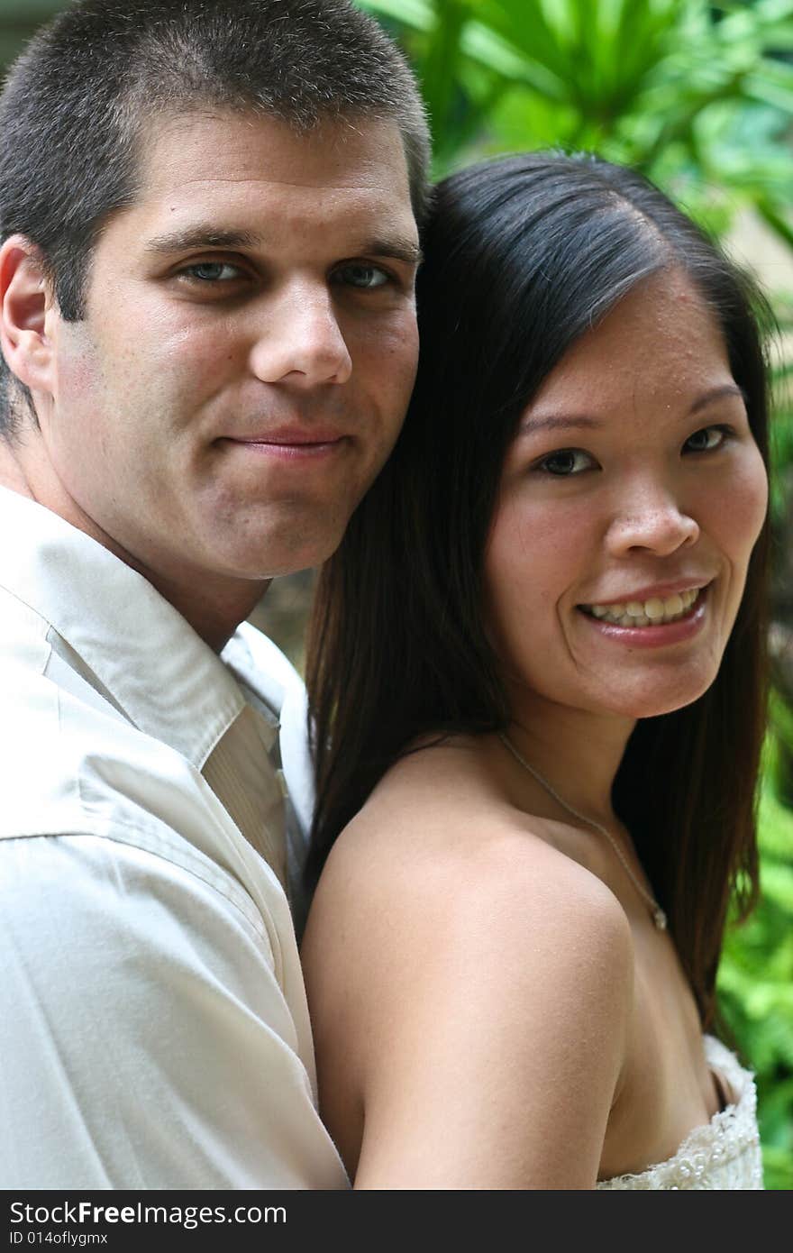 Attractive bride and groom on their wedding day. Attractive bride and groom on their wedding day.