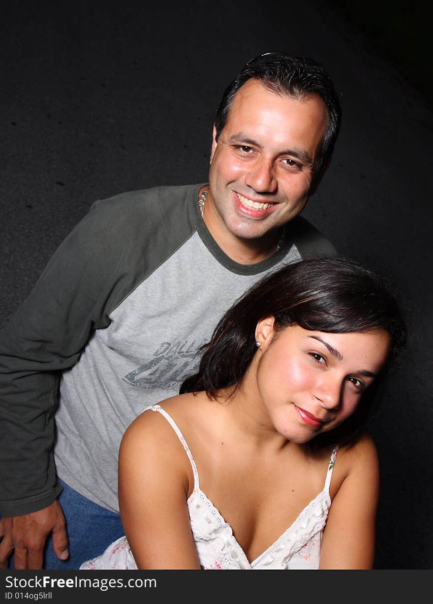 Happy young couple smiling at the camera. Happy young couple smiling at the camera