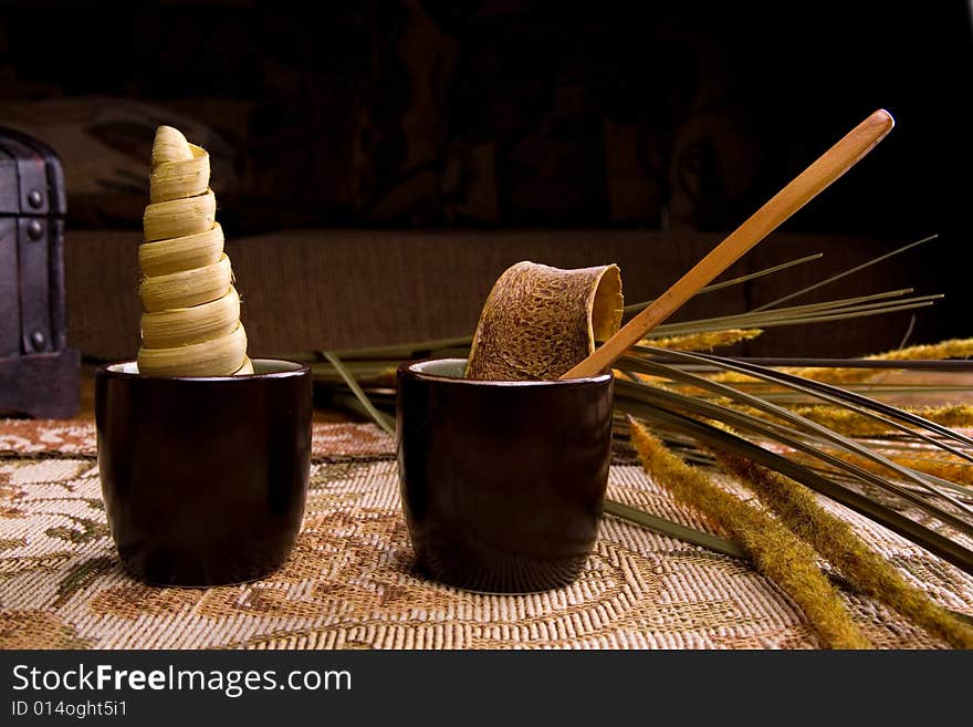 Showing a dried leaves tangering orange petals and wooden spoon. Showing a dried leaves tangering orange petals and wooden spoon.