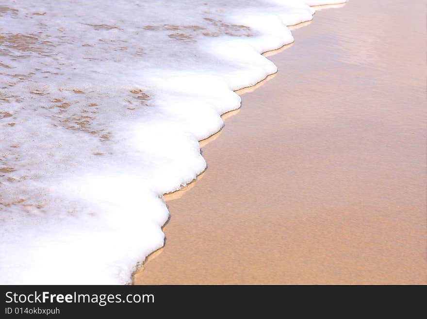 Beautiful white surf washing up on the beach