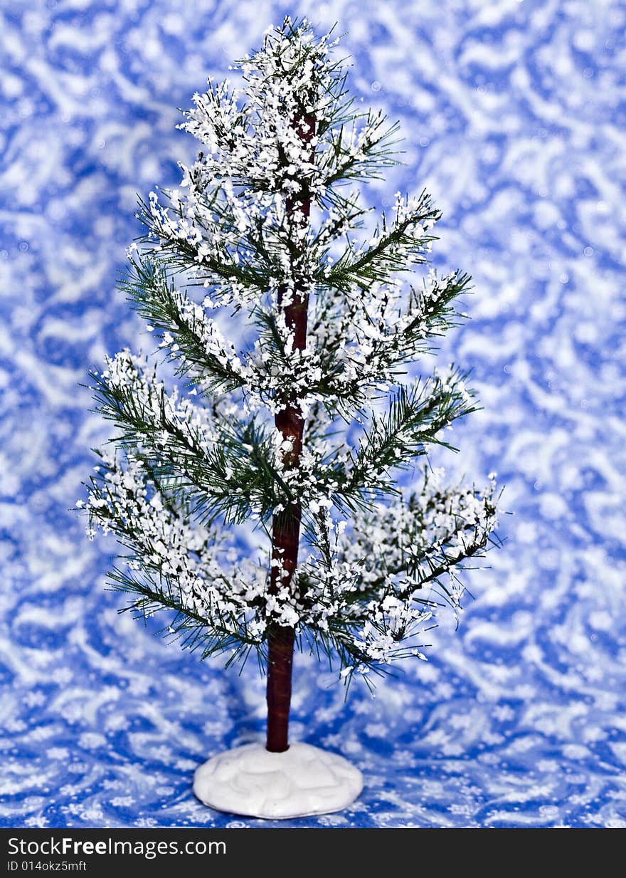 Winter tree on a blue winter background.