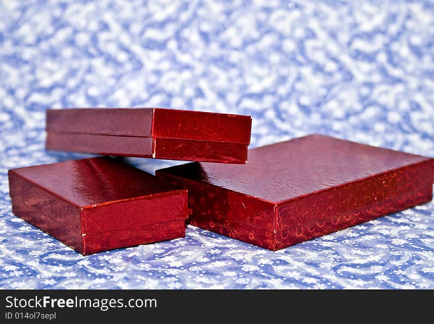 Red gifts on a winter backgrounds.