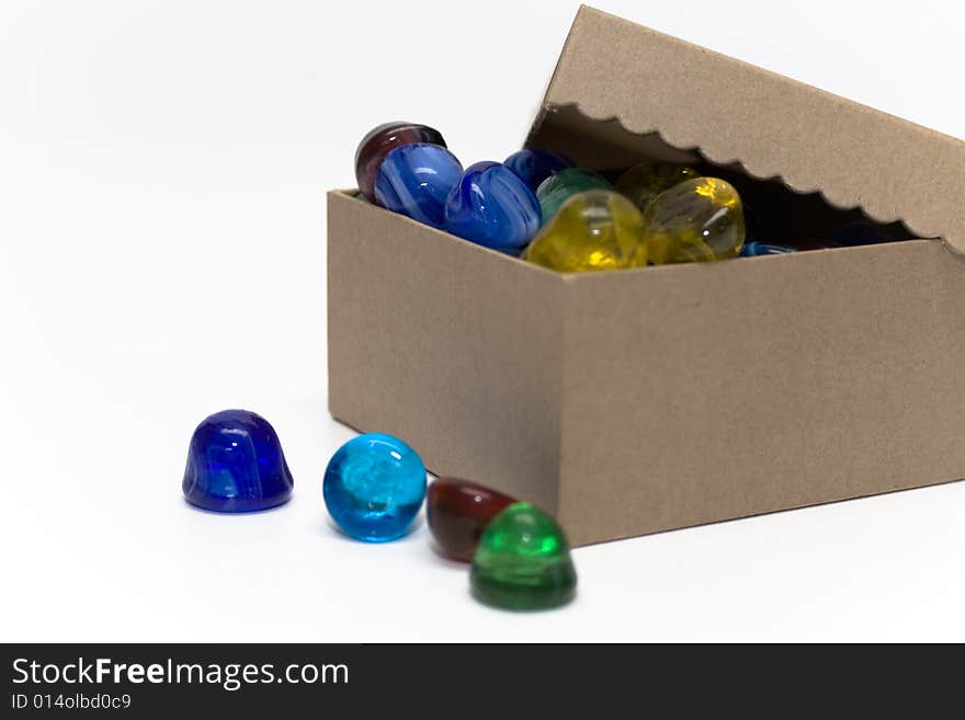 Gift box with colorful glass jewels shaped like gumdrops.