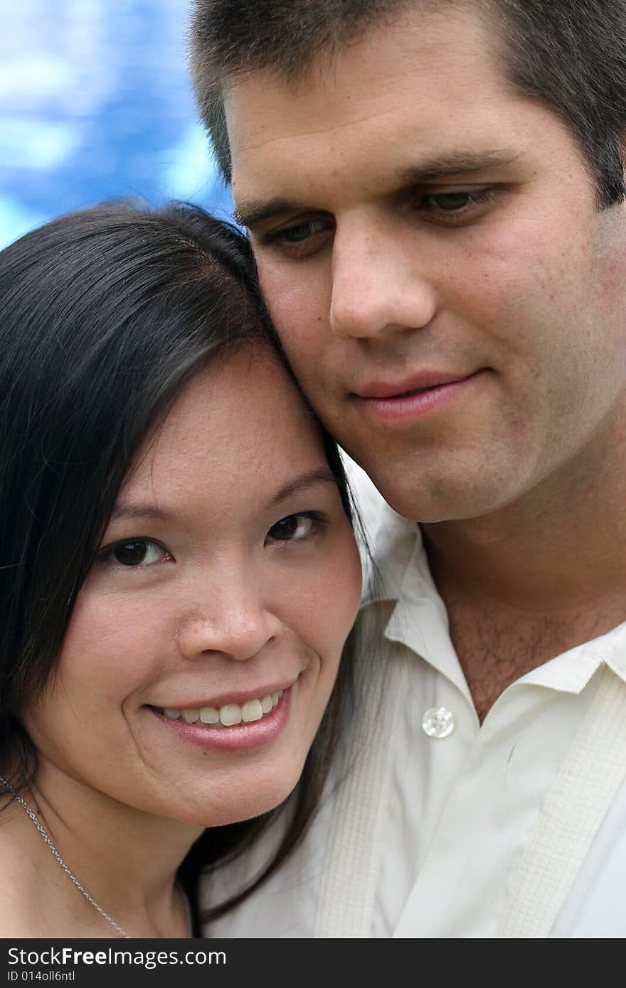 Attractive bride and groom on their wedding day. Attractive bride and groom on their wedding day.