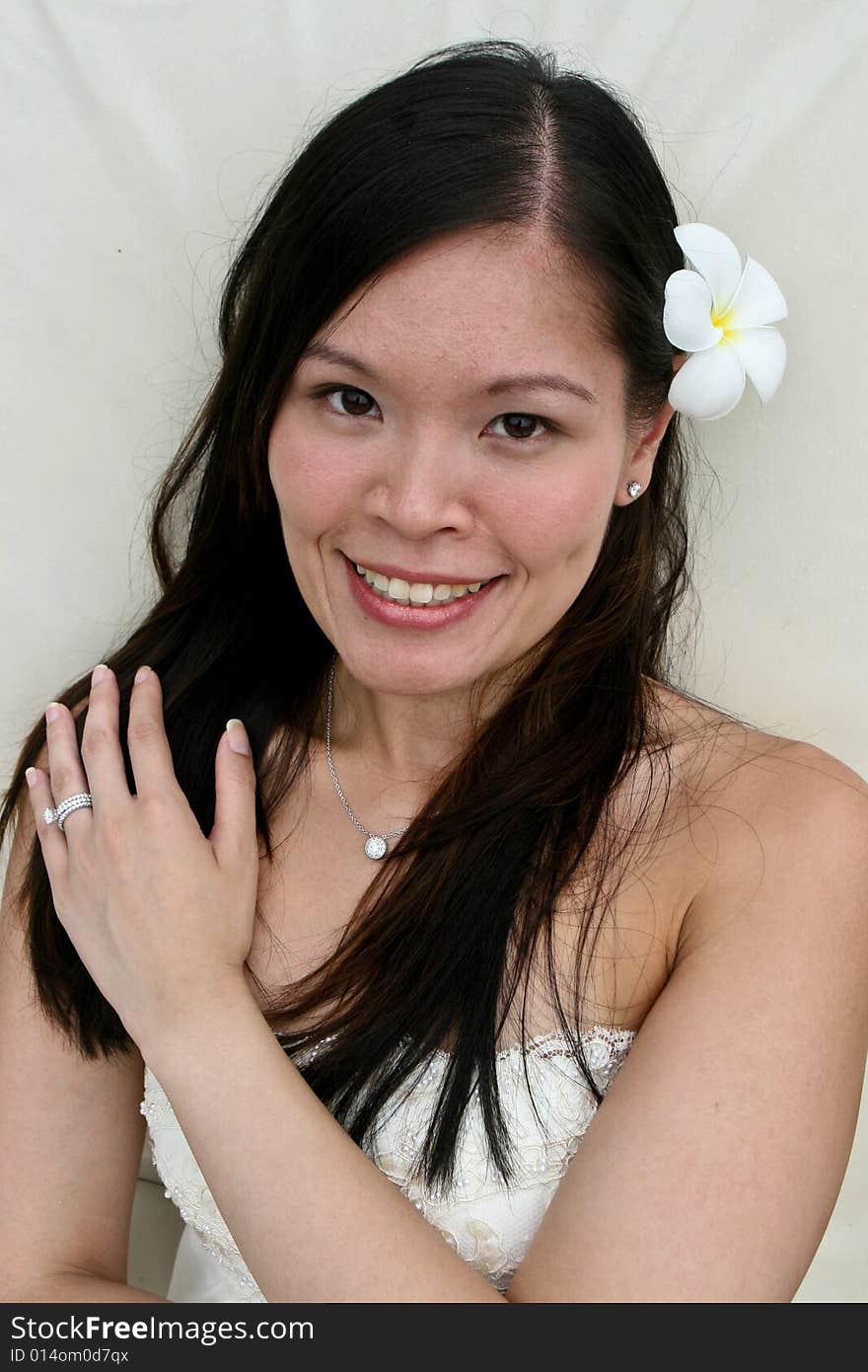 Beautiful Asian bride with a flower in her hair. Beautiful Asian bride with a flower in her hair.