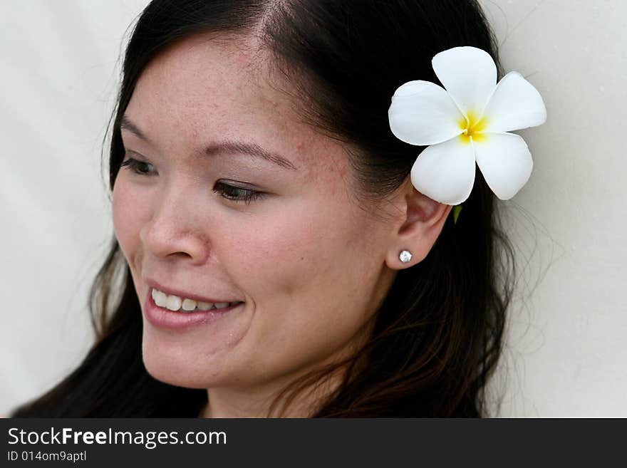 Beautiful Asian bride with a flower in her hair. Beautiful Asian bride with a flower in her hair.