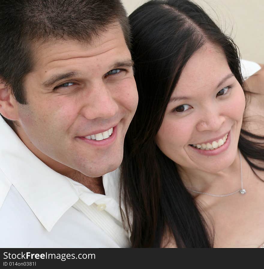 Attractive bride and groom on their wedding day. Attractive bride and groom on their wedding day.