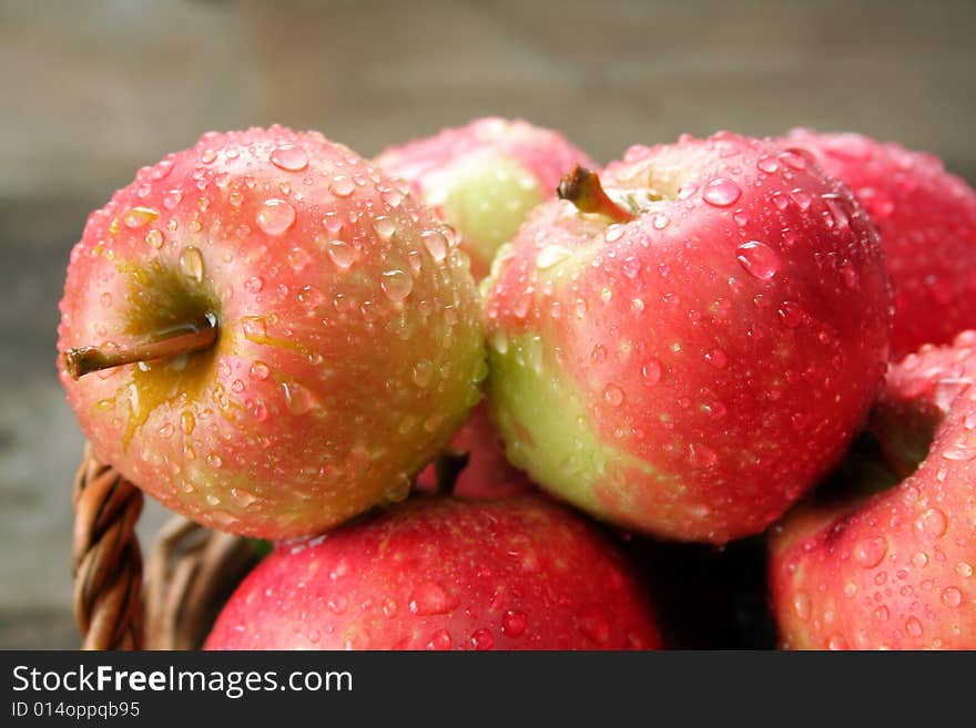 A close up of apples covered with rain drops. A close up of apples covered with rain drops.