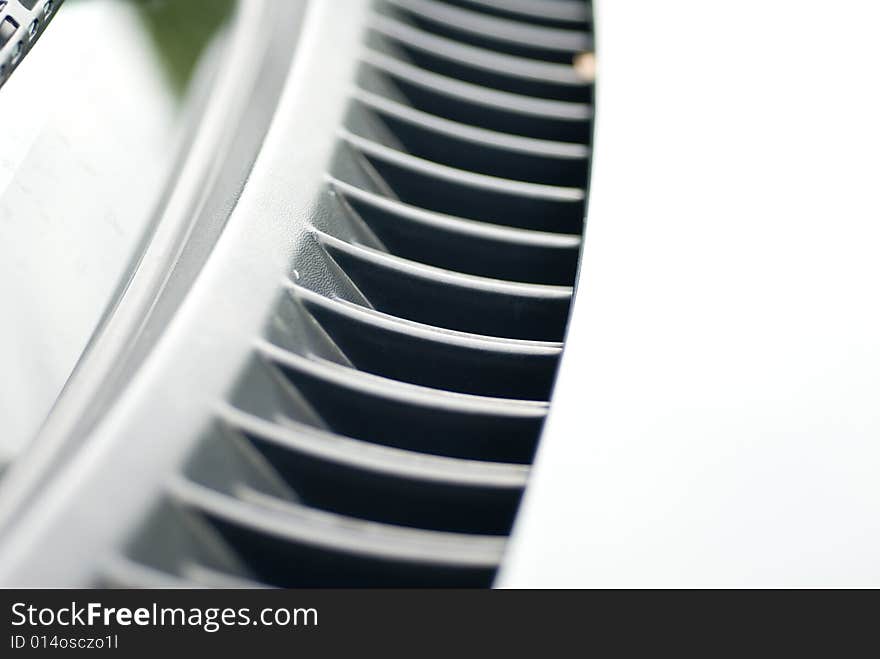 Front automobile vent on a cloudy day. Front automobile vent on a cloudy day.