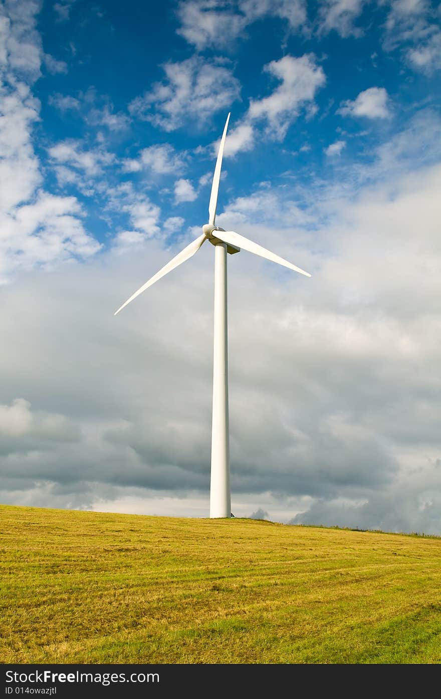 Beautiful green meadow with Wind turbines generating electricity. Beautiful green meadow with Wind turbines generating electricity