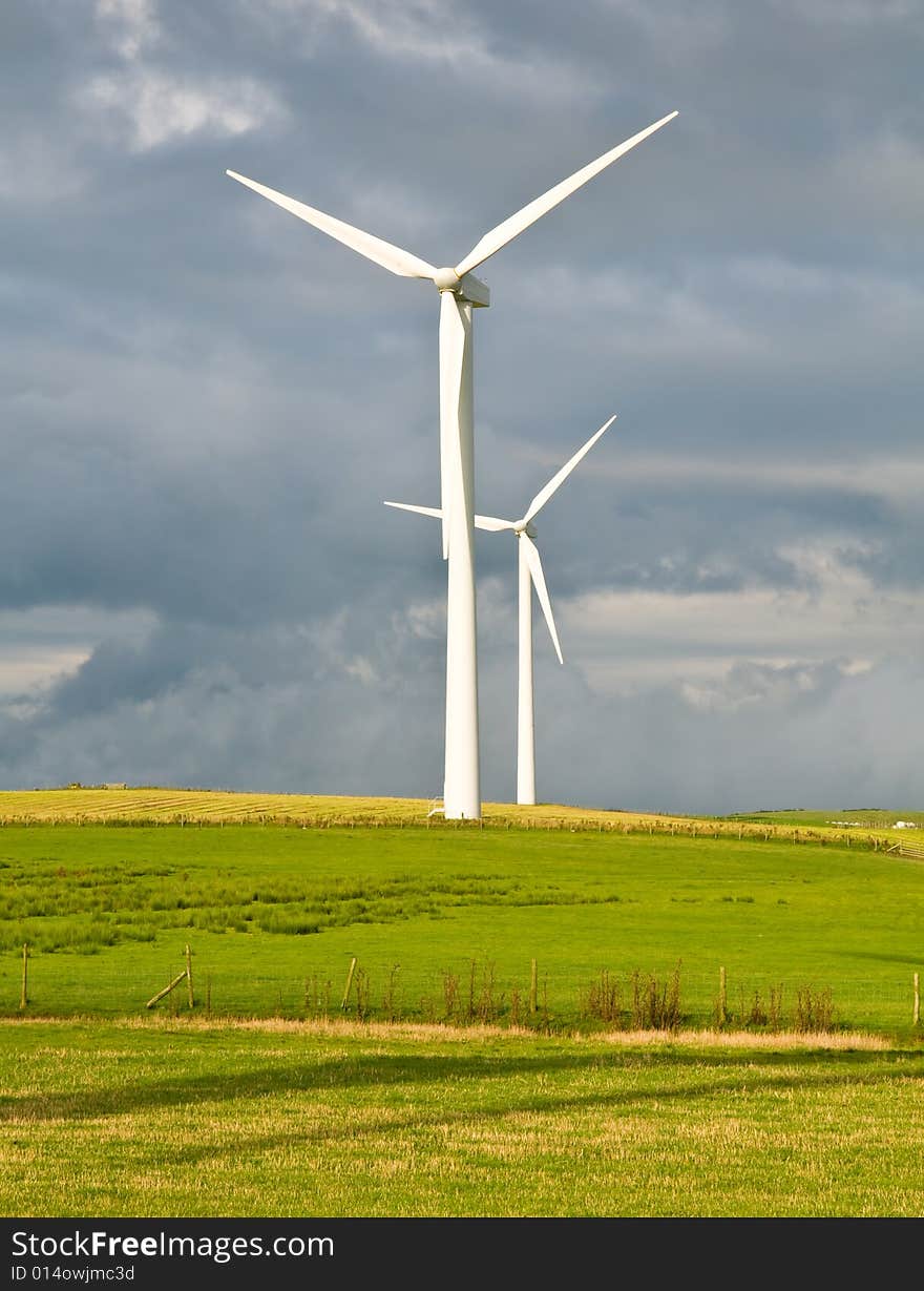 Beautiful green meadow with Wind turbines generating electricity. Beautiful green meadow with Wind turbines generating electricity