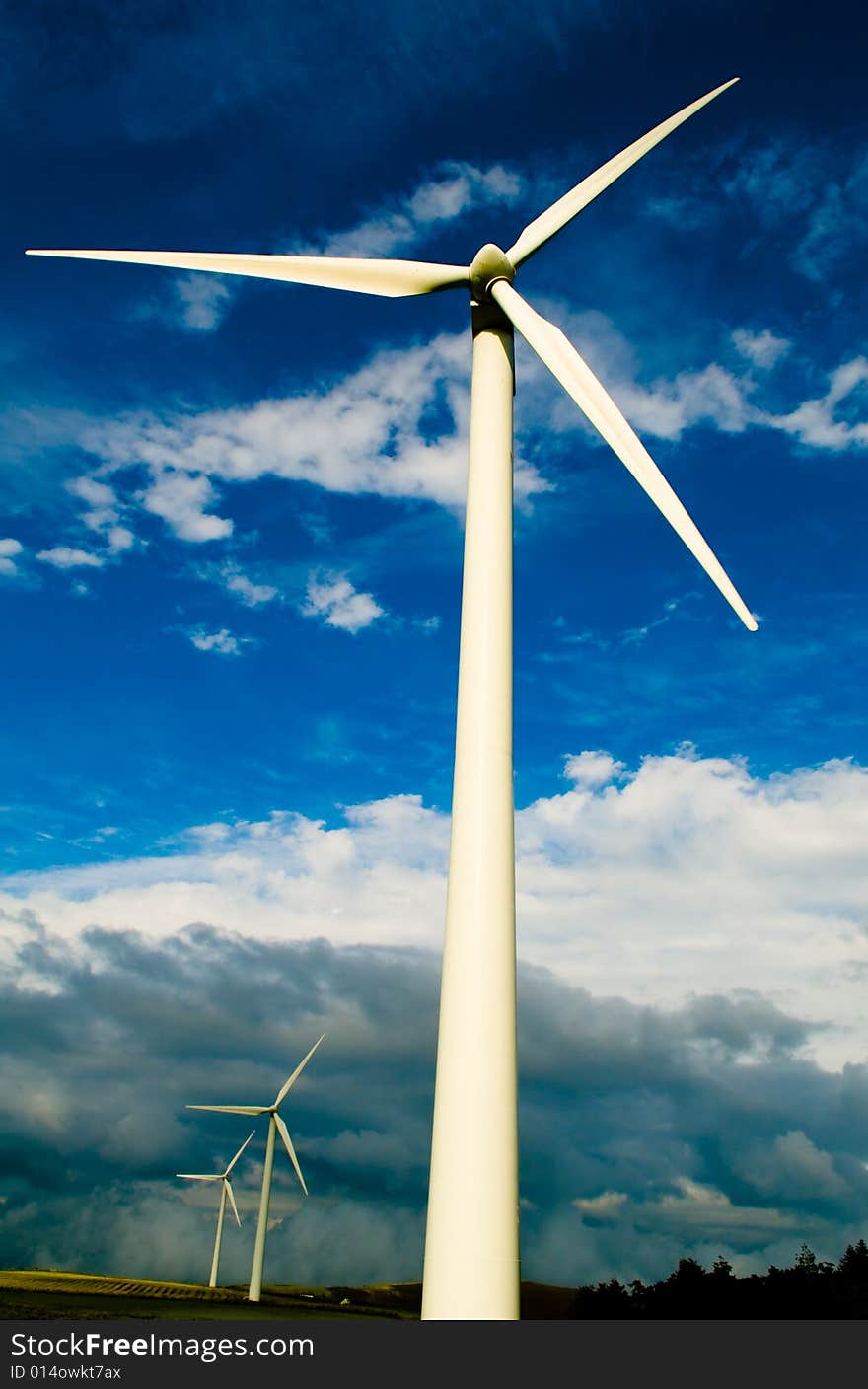 Beautiful green meadow with Wind turbines generating electricity. Beautiful green meadow with Wind turbines generating electricity