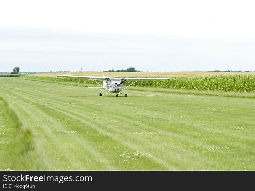 Small airplane on field