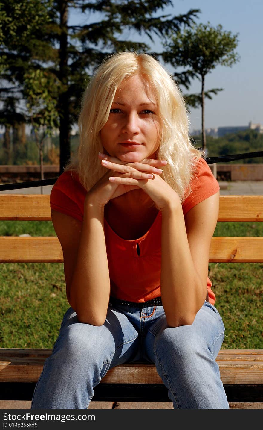 Beautiful girl in a park, looking at camera