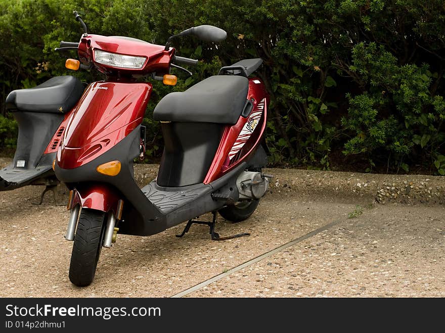 Cute photo of a red Vespa scooter. Cute photo of a red Vespa scooter