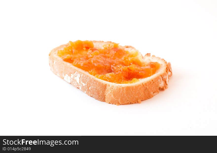 Marmalade spread on bread slice. Marmalade spread on bread slice