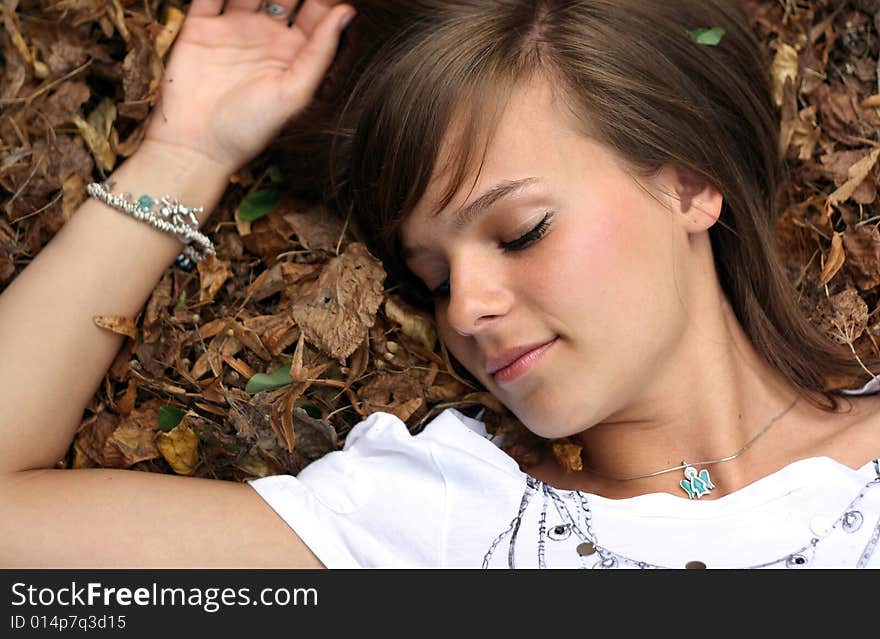 A picture of a girl, smiling and looking on the camera. A picture of a girl, smiling and looking on the camera