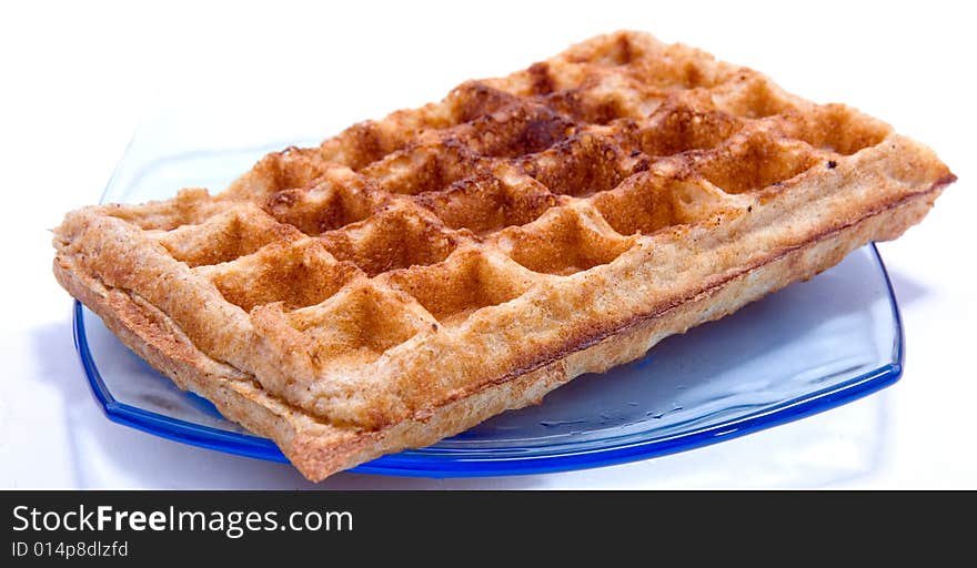 Waffle on plate isolated on white background