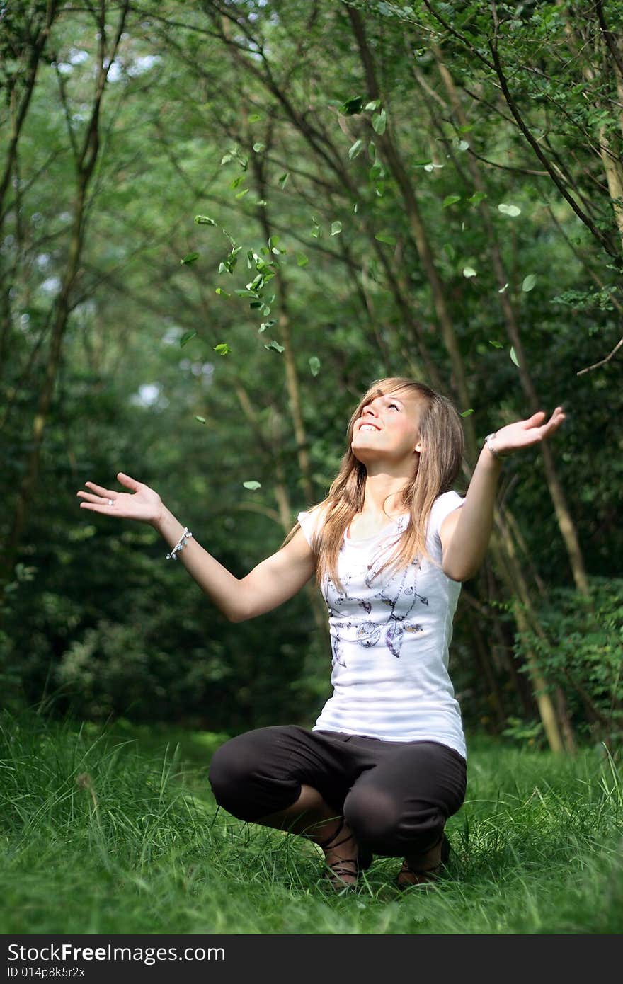 Picture of a teenager throwing the leaves. Picture of a teenager throwing the leaves