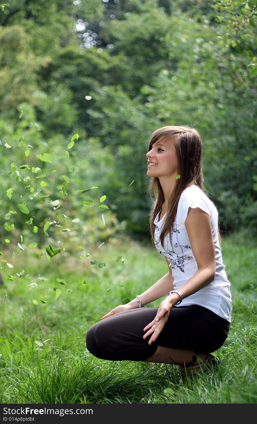 Picture of a teenager throwing the leaves. Picture of a teenager throwing the leaves