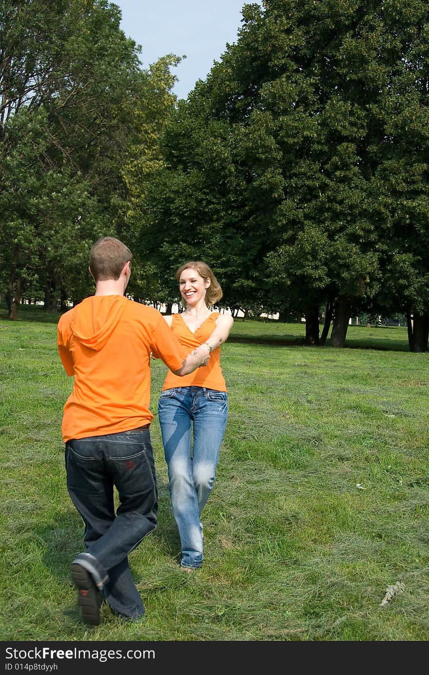 Loving couple plays in a park