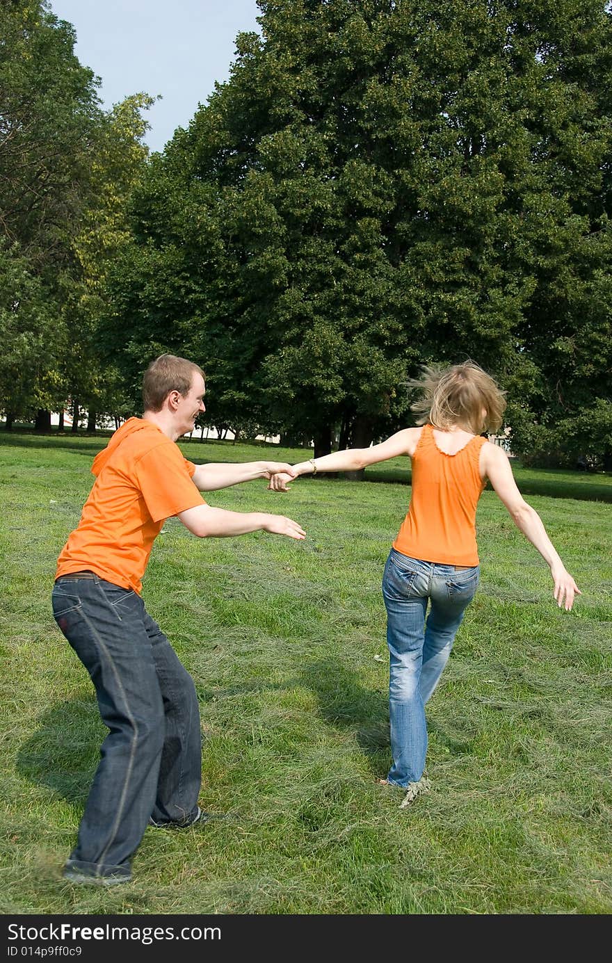 Loving couple plays in a park