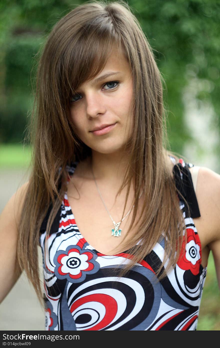 The photo presents young caucasian girl looking at a lens of high resolution camera.
The picture was taken in a serene area among the trees. The photo presents young caucasian girl looking at a lens of high resolution camera.
The picture was taken in a serene area among the trees.