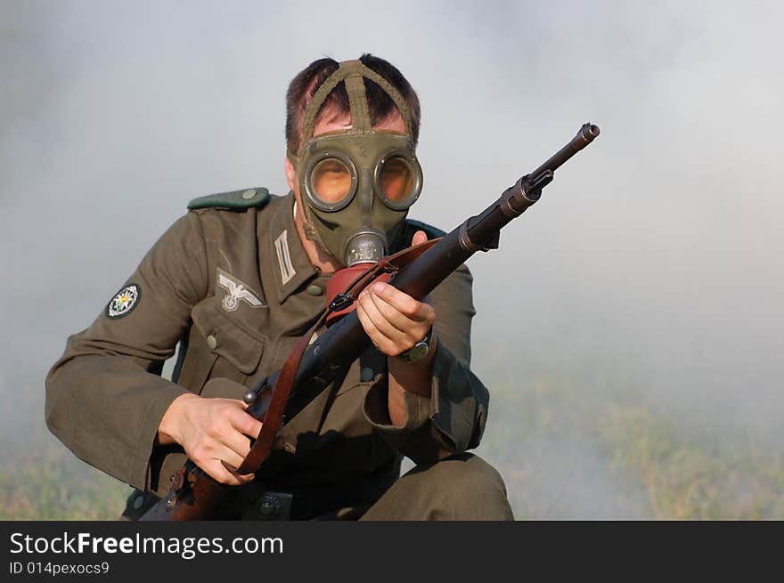 German soldier in gas mask . WW2 reenacting