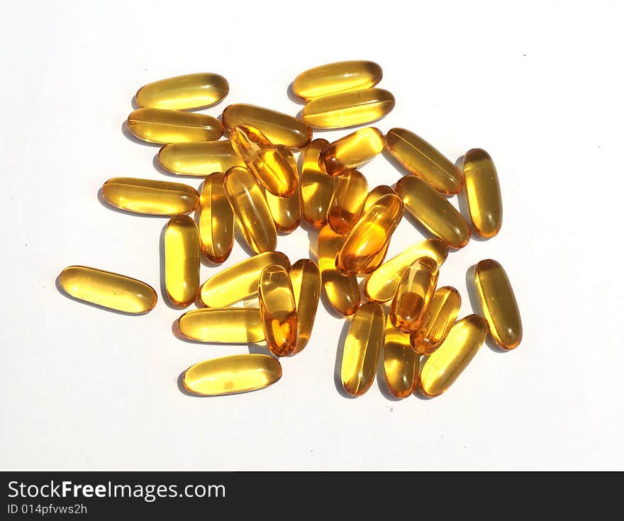 The yellow medicine capsules.