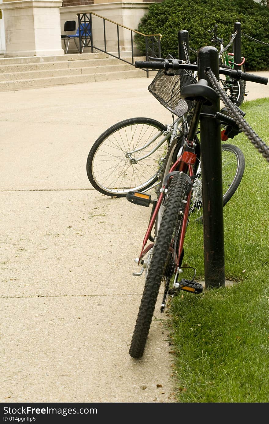 Bike locked on rack at a university campus. Bike locked on rack at a university campus.