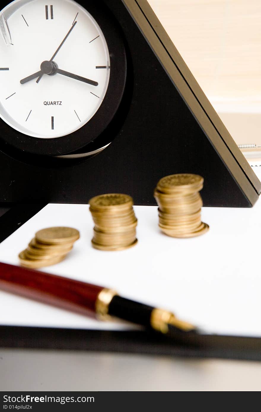 Black clock and money on table. Black clock and money on table