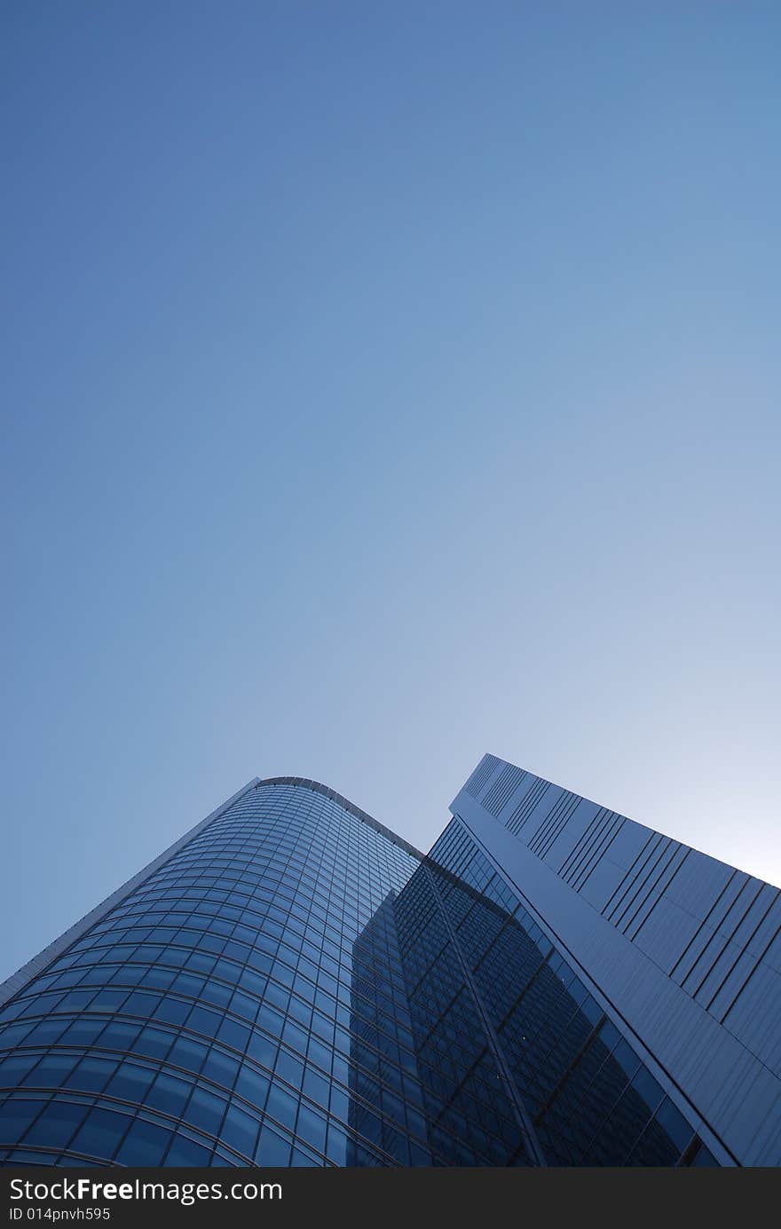 Highrise glass building with sky and clouds reflection. Highrise glass building with sky and clouds reflection