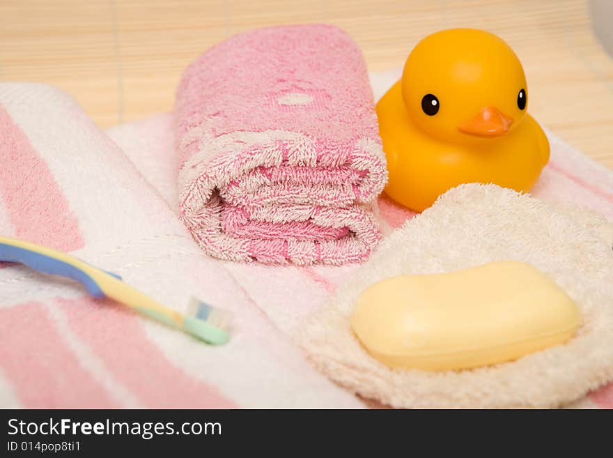 Yellow duck and pink bathtowel