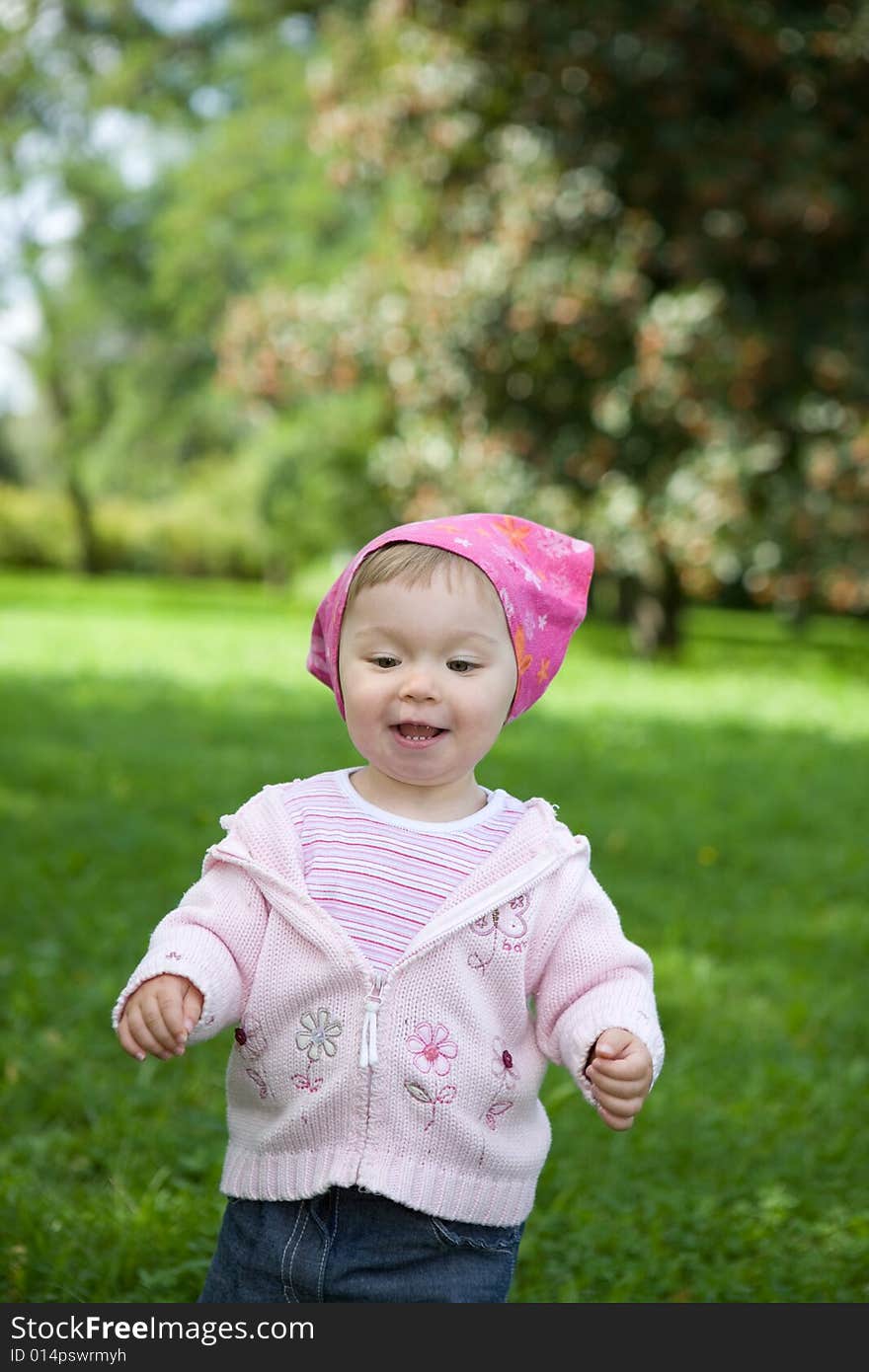 Happy baby girl in park. Happy baby girl in park