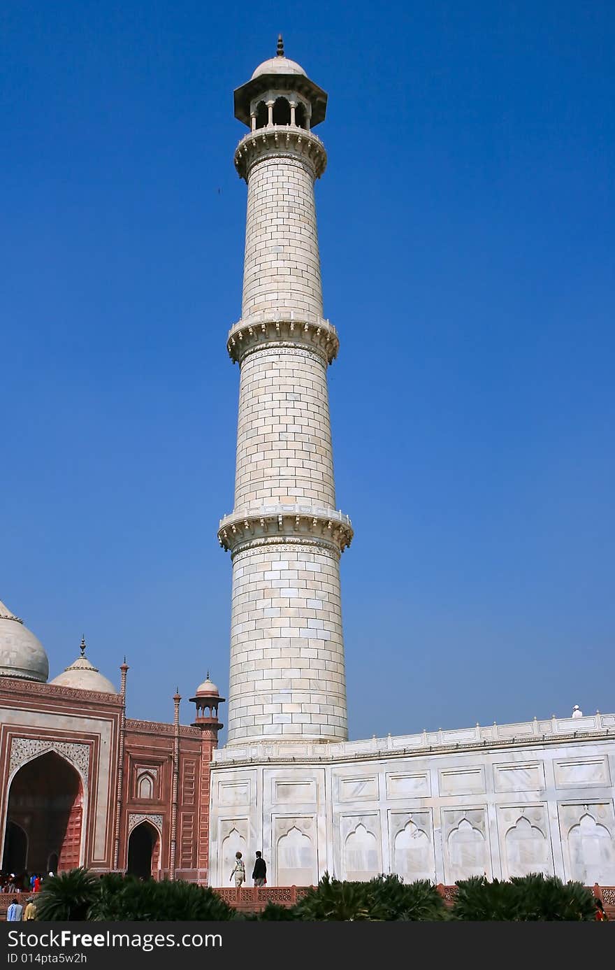 Upward point of view of one of the minarets on the corner of Taj Mahal mausoleum in Agra, India.