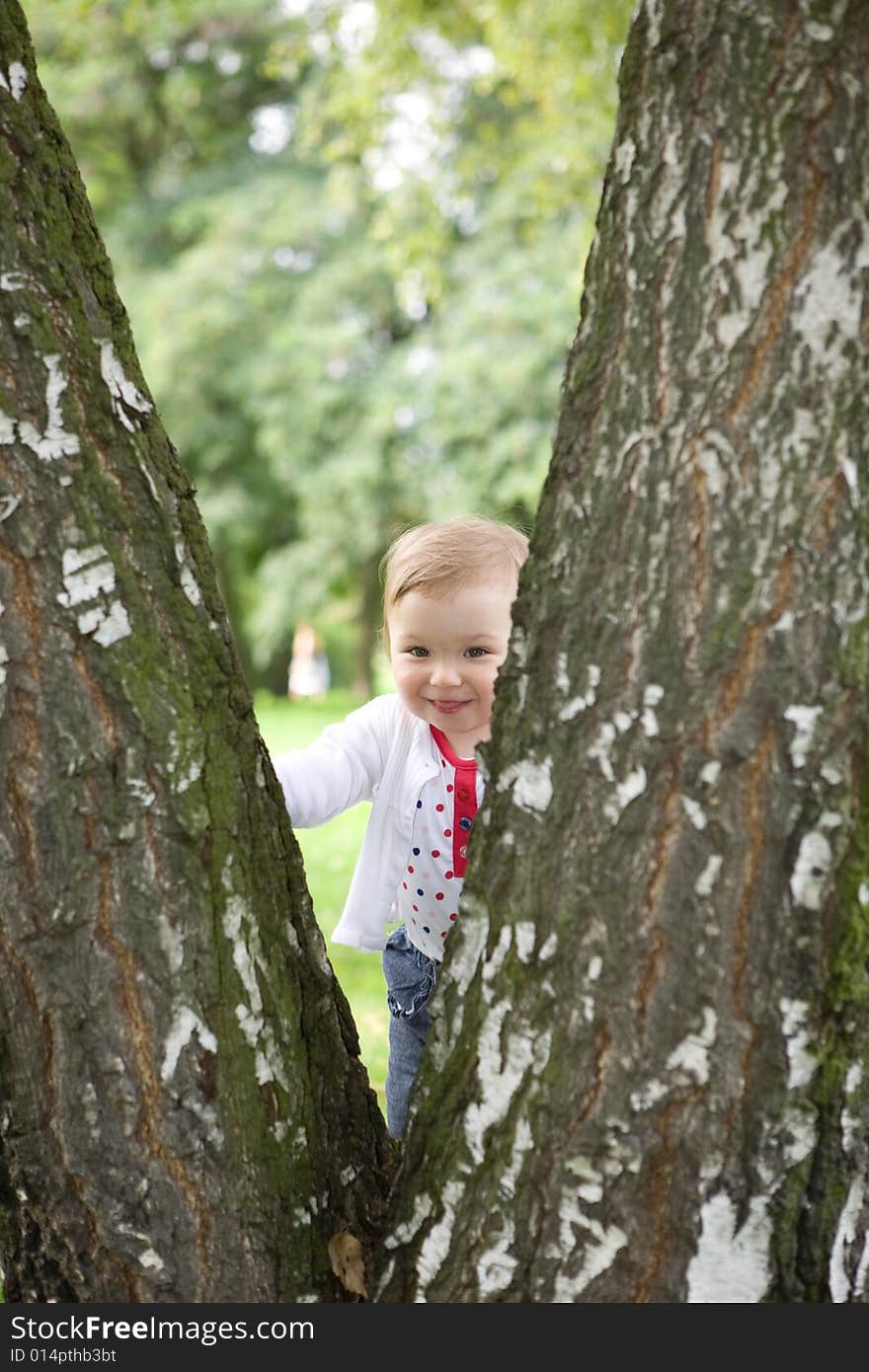 Happy baby girl in park. Happy baby girl in park