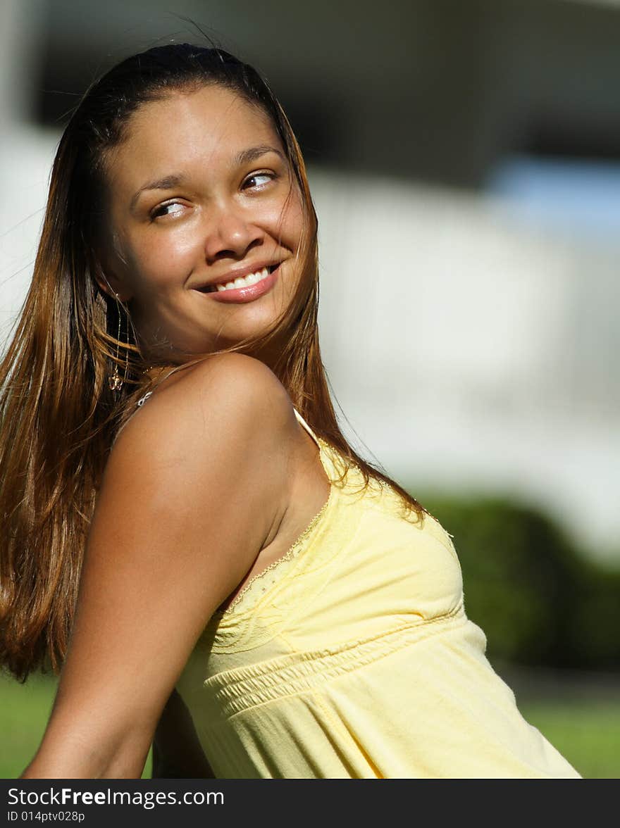 Young woman wearing a yellow dress. Young woman wearing a yellow dress