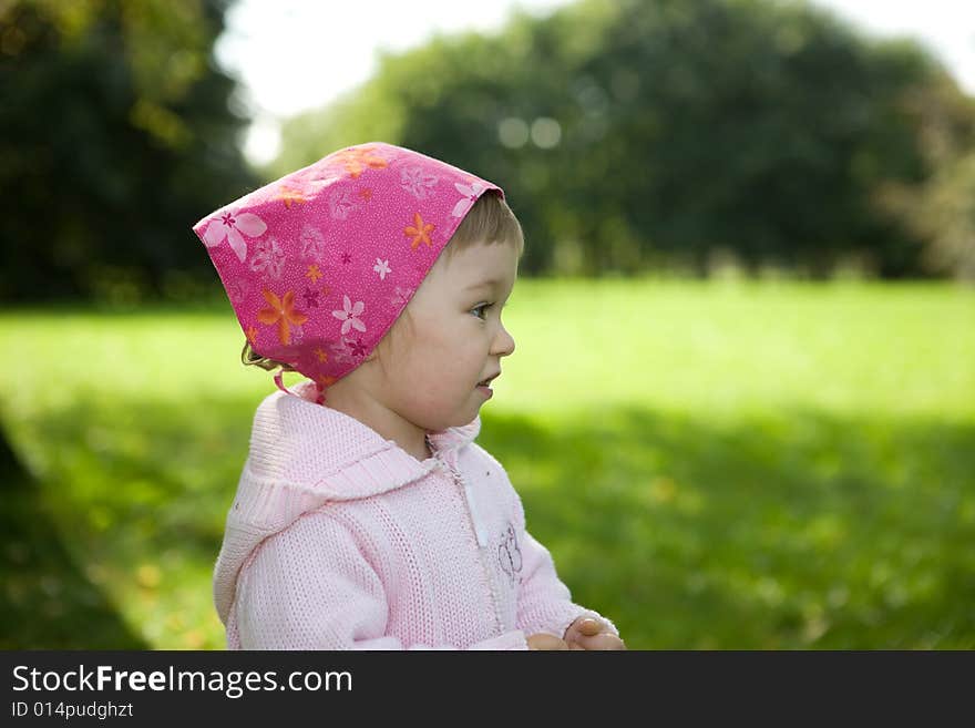 Happy baby girl in park. Happy baby girl in park