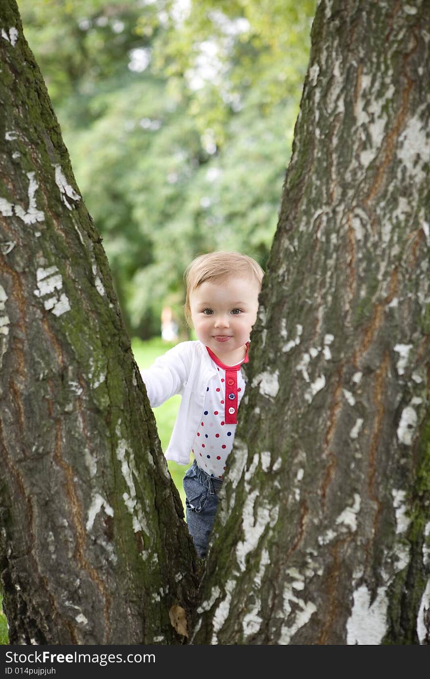 Happy baby girl in park. Happy baby girl in park