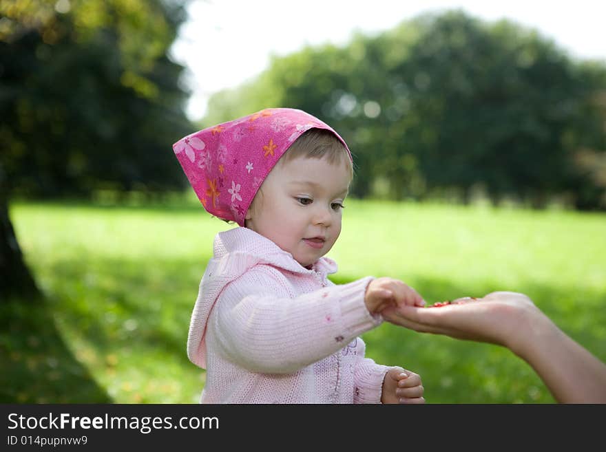 Happy baby girl in park. Happy baby girl in park