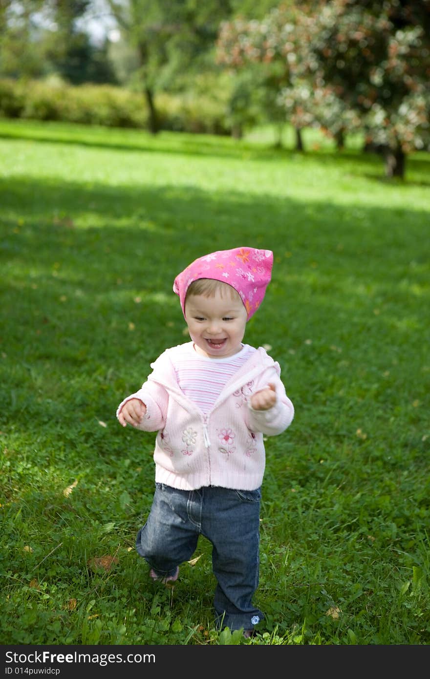 Happy baby girl in park. Happy baby girl in park