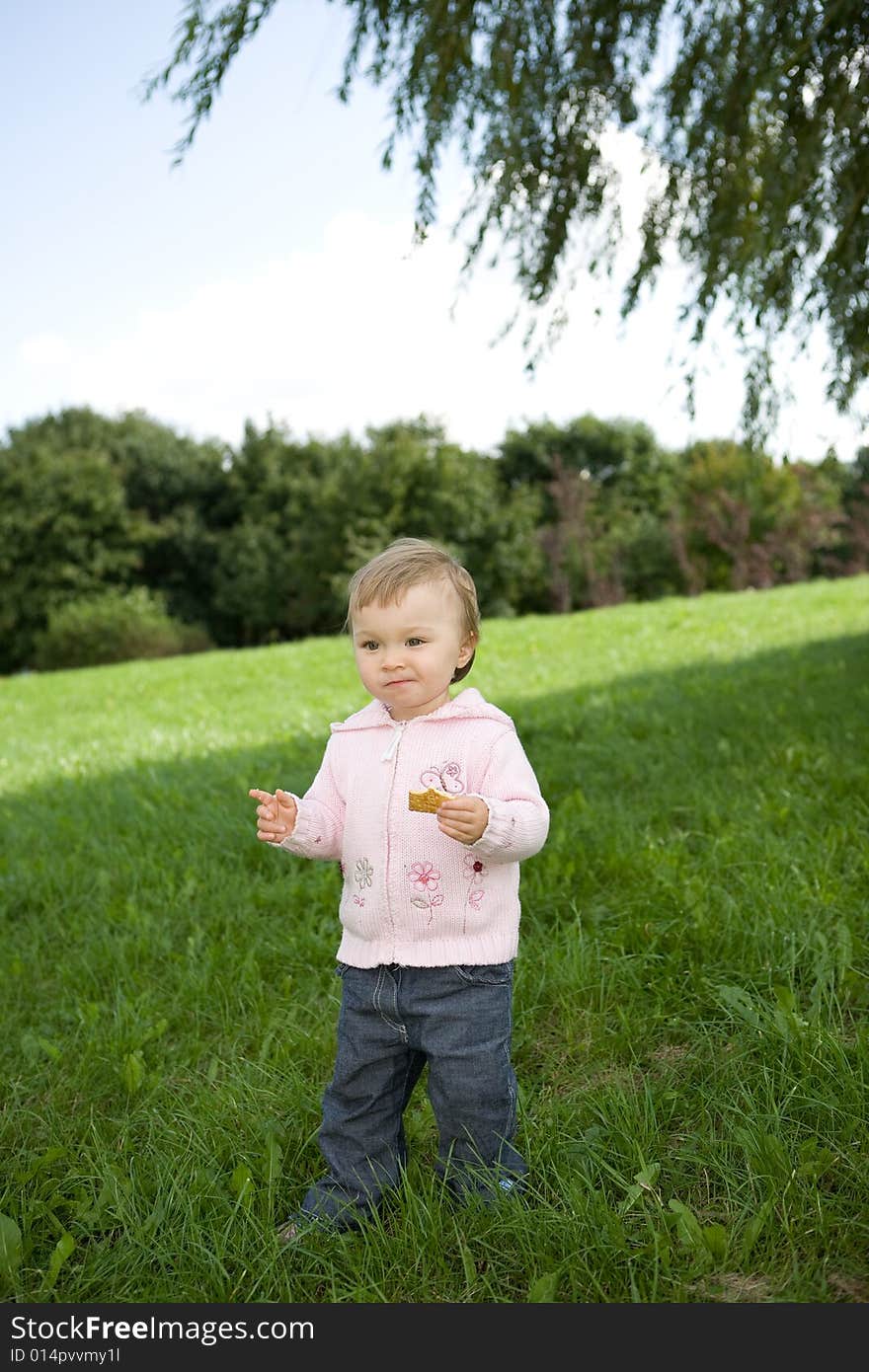 Happy baby girl in park. Happy baby girl in park