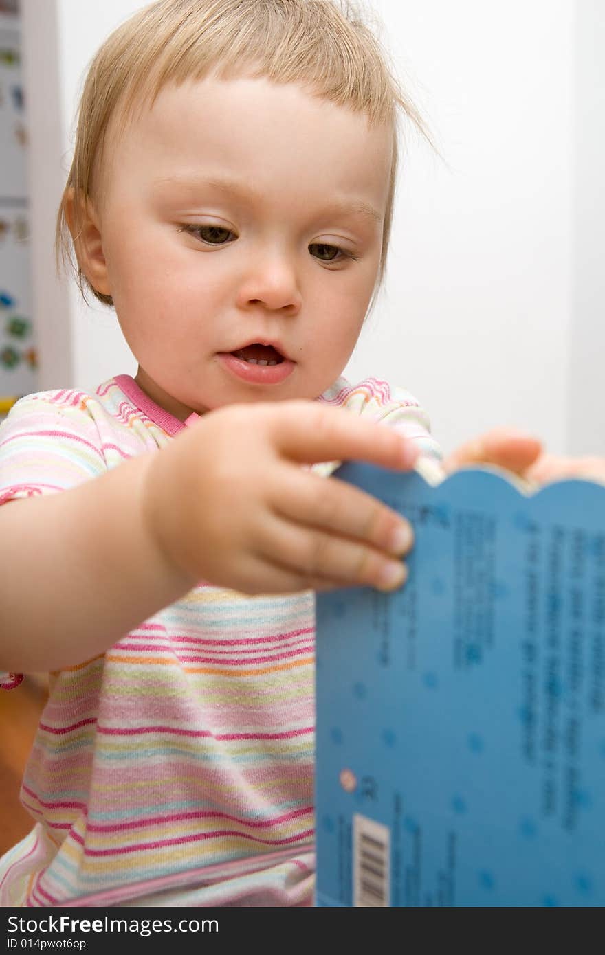 Sweet toddler baby girl reading. Sweet toddler baby girl reading