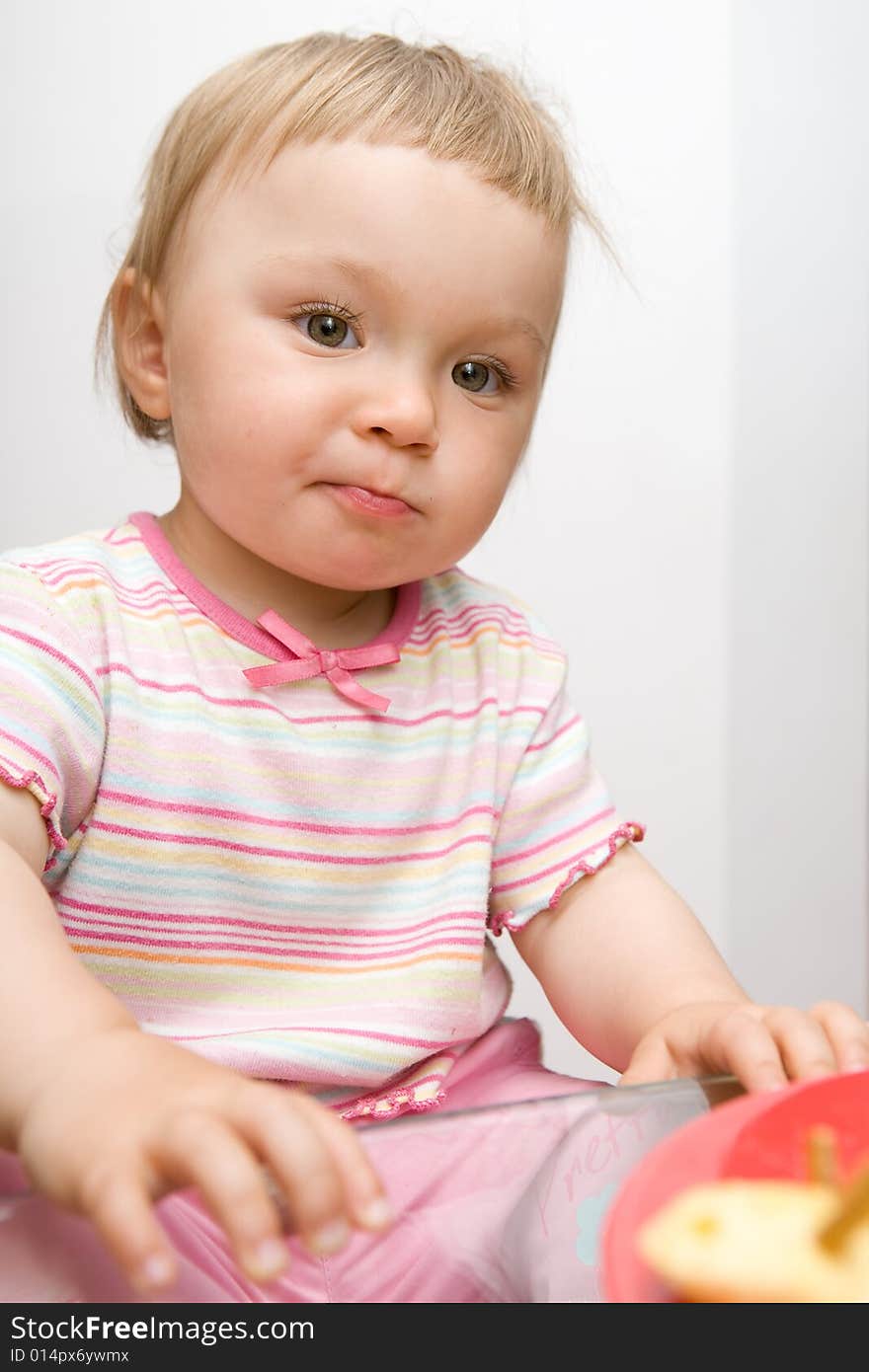 Sweet toddler  baby girl eating. Sweet toddler  baby girl eating