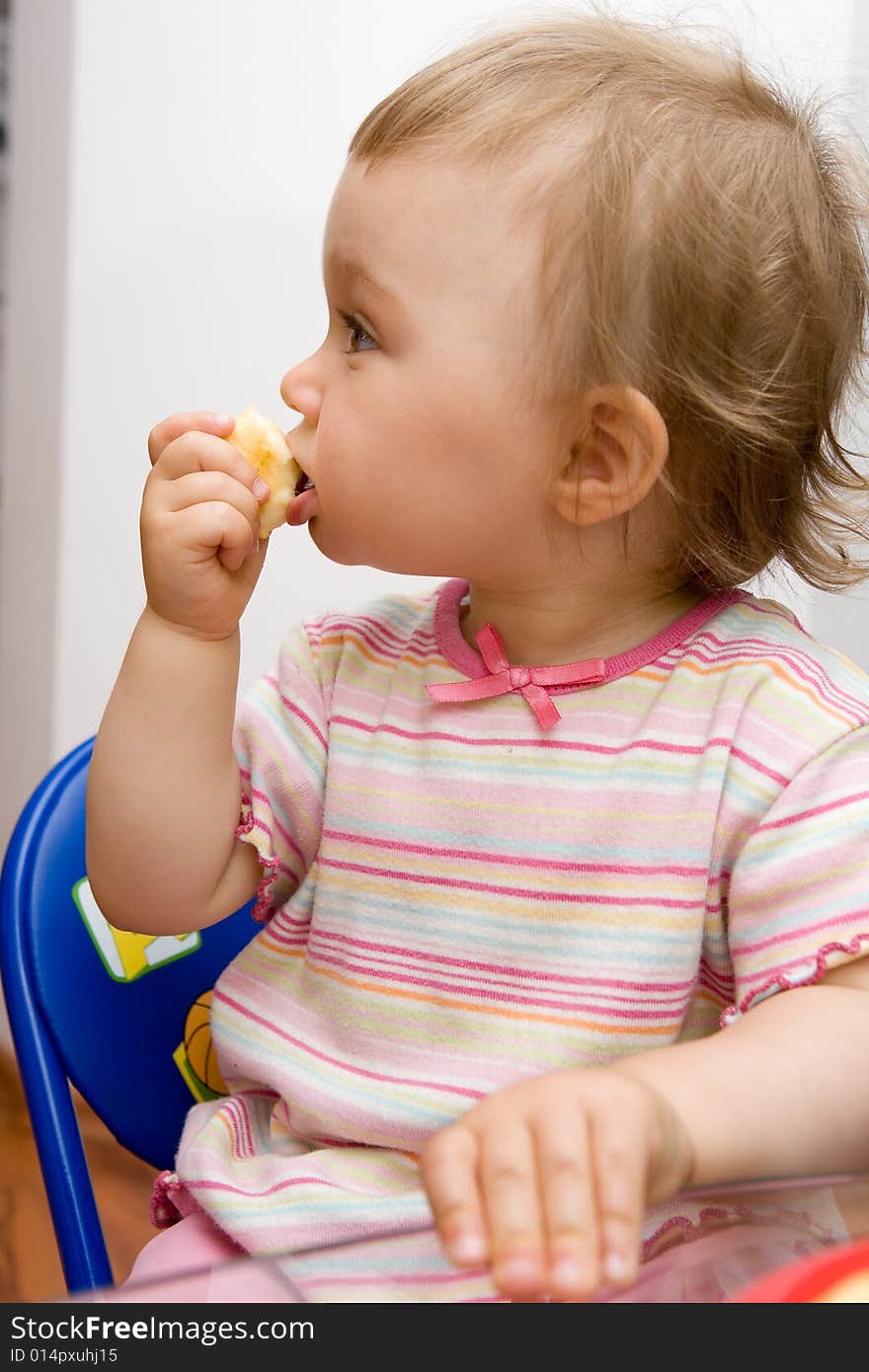 Sweet toddler baby girl eating. Sweet toddler baby girl eating