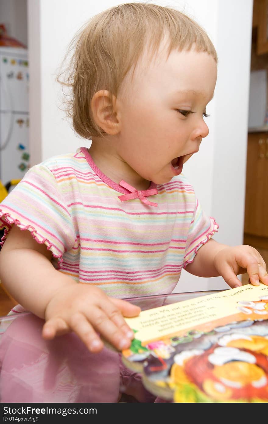 Sweet toddler baby girl reading. Sweet toddler baby girl reading