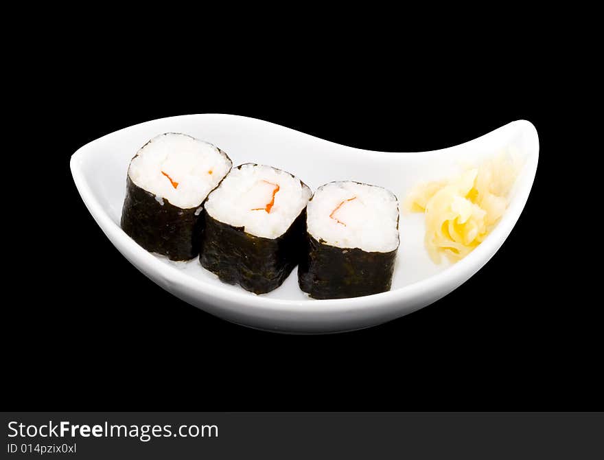 A white plate with a piece of sushi