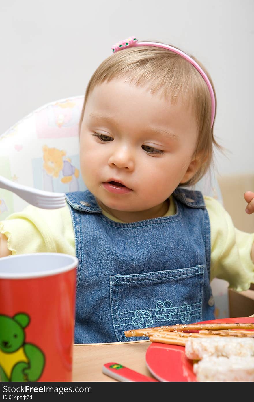 Sweet toddler baby girl eating. Sweet toddler baby girl eating